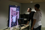 Dos treballadors de l'empresa Futura Space fan proves amb el seu 'software' per generar hologrames, a les oficines que tenen a la seu Barcelona Activa