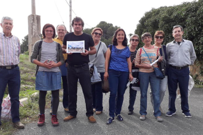 Part de les persones que van participar en la visita guiada i la fotografia que va ser sortejada.