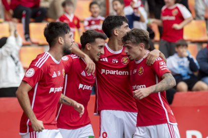 Jaume Jardí, Marcos Baselga, Marc Montalvo i Pau Martínez celebrant plegats el gol de la victòria contra el Marbella.