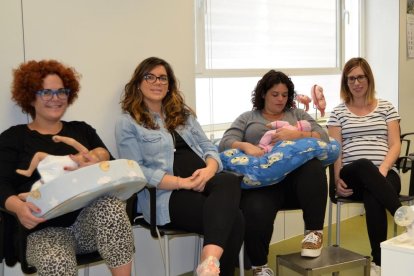 Una exposición fotográfica muestra cómo viven el amamantamiento materno las familias