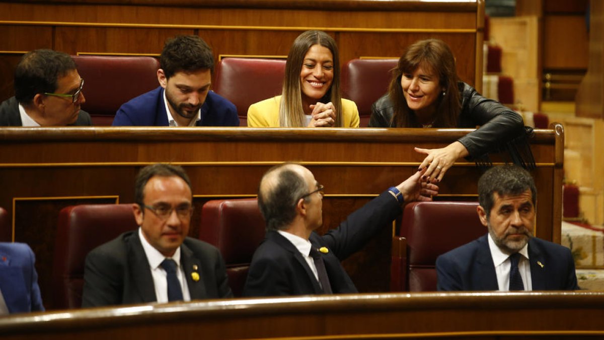 Los diputados de JxCat Jordi Sànchez, Jordi Turull y Josep Rull, sentados en los escaños del Congreso de los Diputados durante la sesión constitutiva del 21 de mayo del 2019