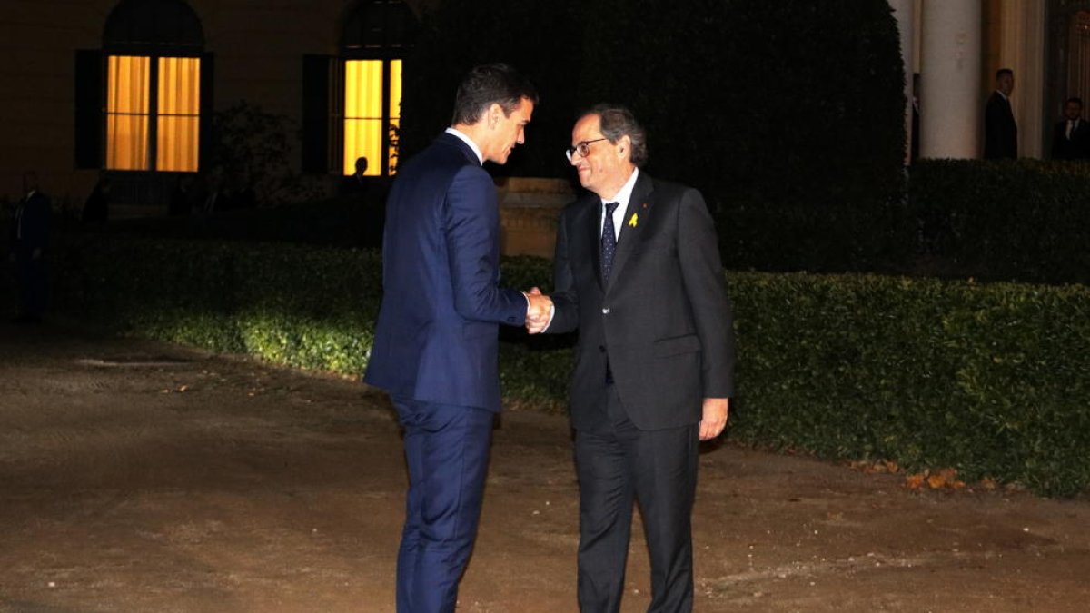 El presidente español y el catalán durante el encuentro en Barcelona el pasado 21-D