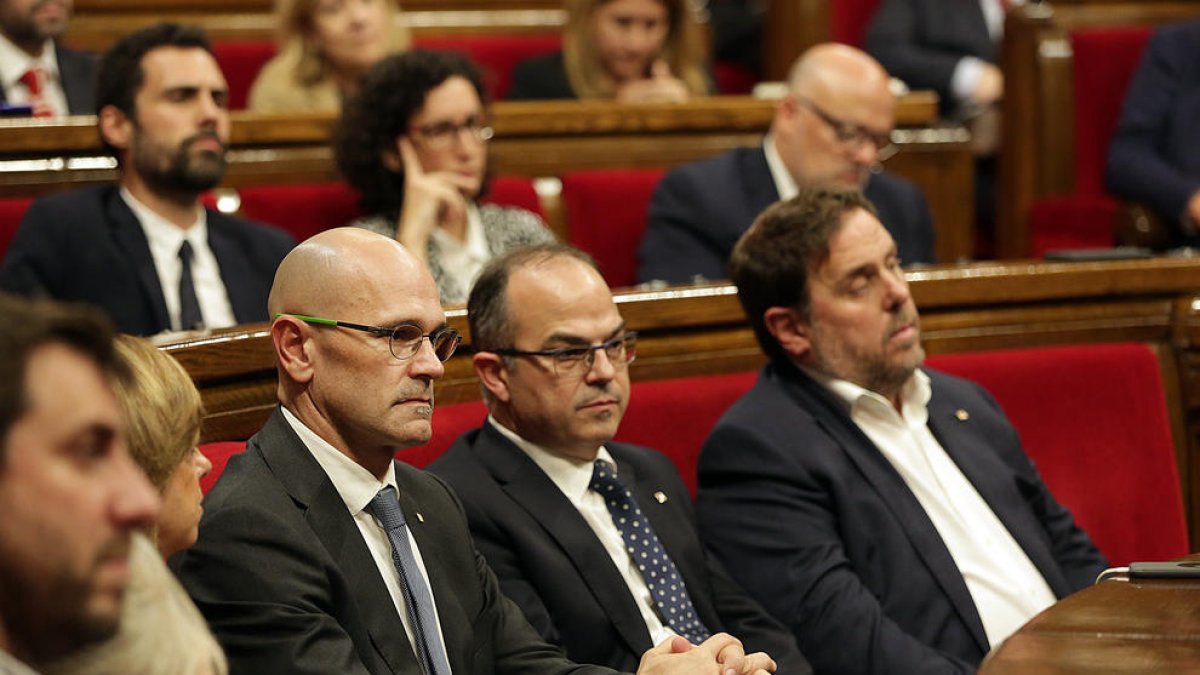 Raül Romeva, Jordi Turull i Oriol Junqueras al Parlament.