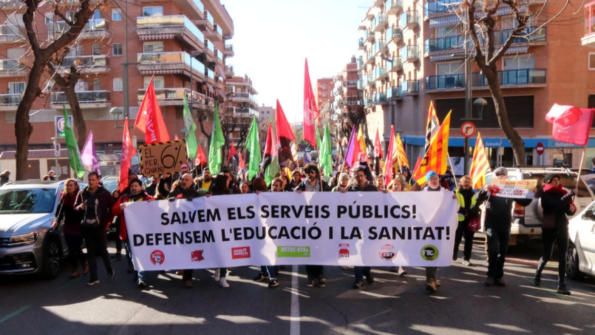 Una de les pancartes subjectadesde la maniestació.