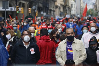 Los secretarios generales de CCOO y UGT en la manifestación de 2021.