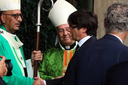 Carles Puigdemont i Joan Josep Omella en una imatge d'arxiu.