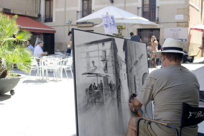 Un quadre amb el carrer de la Verge de la Pineda.