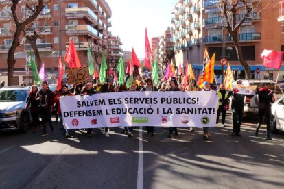 Una de les pancartes subjectadesde la maniestació.