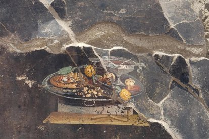 El análisis de un fresco en Pompeya ha mostrado lo que podría ser un plato antepasado de la actual pizza.