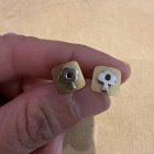 Imatge de les arracades que van a joc amb la pulsera d'or robada a Tarragona a una anciana.