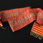 La faixa d'honor de 1932, que es va atorgar a la Colla Vella dels Xiquets de Valls, guanyadora de la primera edició del concurs (horitzontal).
