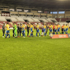 Imatge dels jugadors del Nàstic amb la samarreta grga i blava.