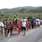 Els Portants de l'Aigua, amb els seus carros i cavalls, passant pel Pont d'Armentera.