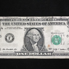 Imatge del bitllet d'un dòlar amb el missatge.