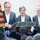 Els candidats de JxCat Josep Rull, Jordi Sànchez i Jordi Turull, en videoconferència des de la presó de Soto del Real.