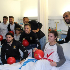 Imagen de la visita de los jugadores del Nàstic durante la Navidad del 2018