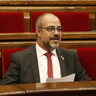 Plano medio del conseller de Interior, Miquel Buch, en el pleno del Parlament del 9 de octubre de 2019.