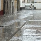 Carrers mullats a Mollerussa durant un episodi de pluja intensa generalitzada a Catalunya.