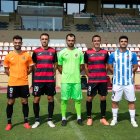 Els jugadors del Reus FC Reddis amb les tres equipacions i també la verda dels porters.