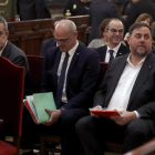 Oriol Junqueras, Raül Romeva i Joaquim Forn, durant la primera sessió del judici el 12 de febrer