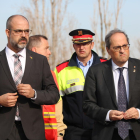 Pla mig del president de la Generalitat, Quim Torra, i el conseller d'Interior, Miquel Buch, sortint de la reunió amb els equips d'emergència.